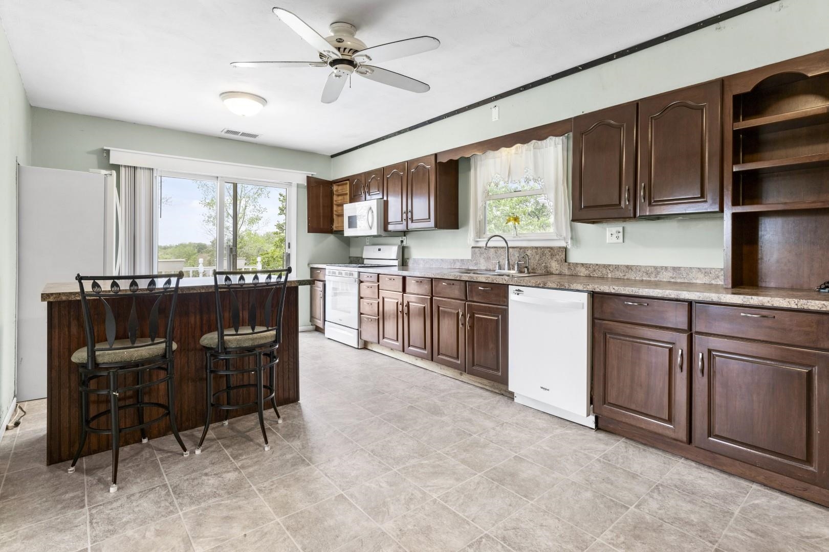 8530 North Kishwaukee Road Stillman Valley, IL 61084 - Photo 4 of 44 a kitchen with a cabinets and chairs
