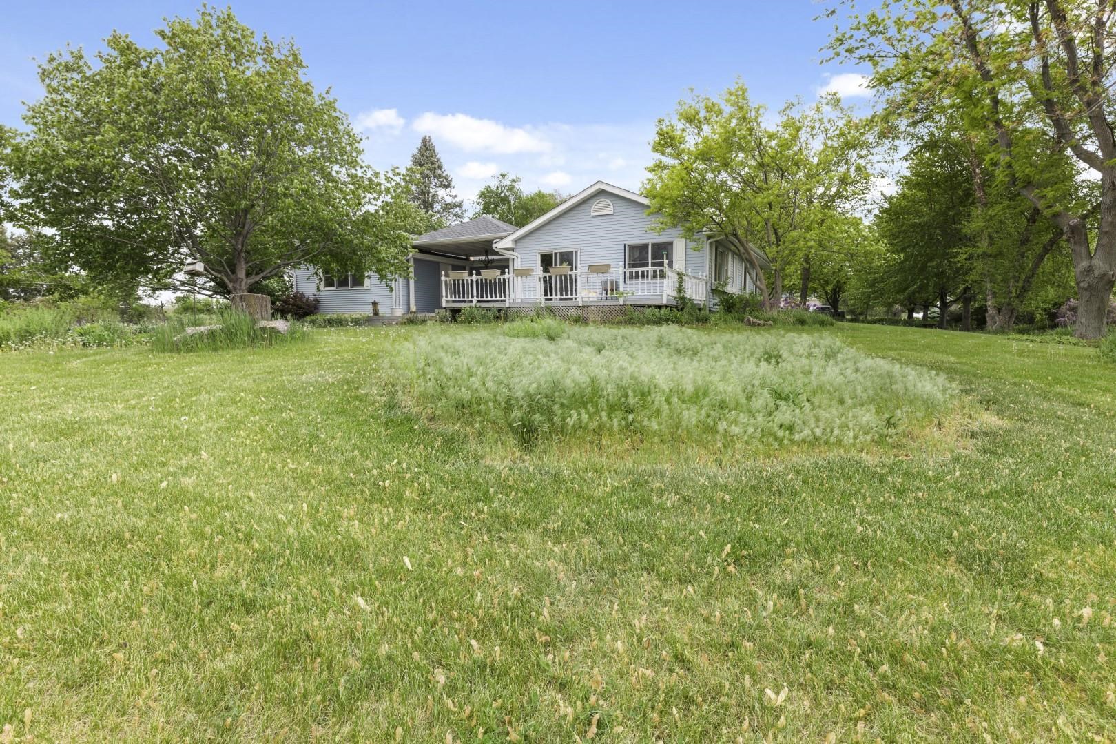 8530 North Kishwaukee Road Stillman Valley, IL 61084 - Photo 43 of 44 a front view of a house with garden