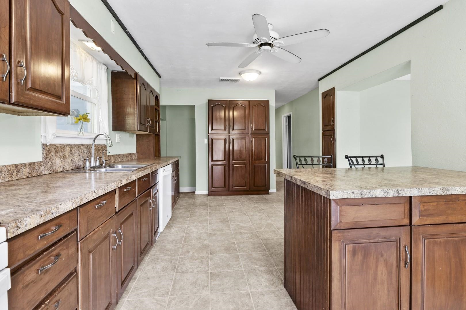 8530 North Kishwaukee Road Stillman Valley, IL 61084 - Photo 6 of 44 a kitchen with granite countertop a sink and cabinets