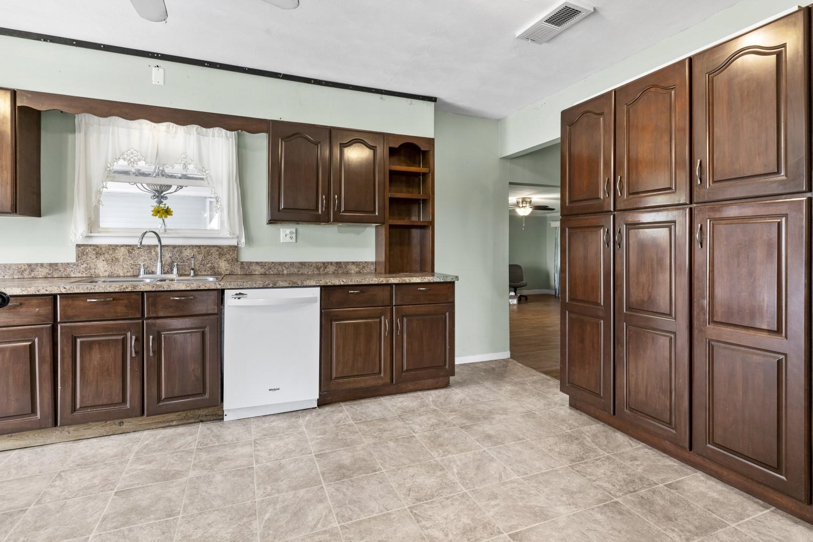 8530 North Kishwaukee Road Stillman Valley, IL 61084 - Photo 7 of 44 a kitchen with stainless steel appliances granite countertop a refrigerator and a sink