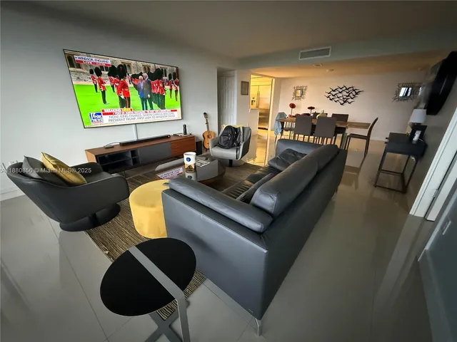 a bedroom with a bed and a mirror