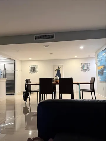 a view of a lake with houses in the back