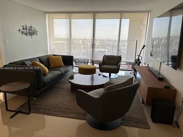 a view of a dining room with furniture and a mirror