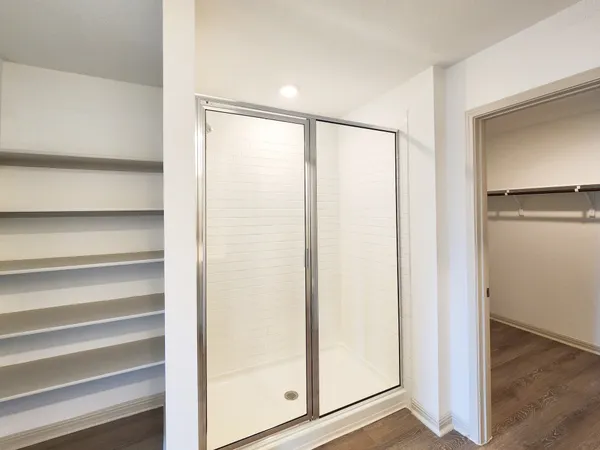 a view of front door with wooden floor