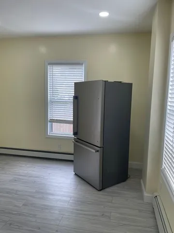 a refrigerator freezer sitting in a kitchen