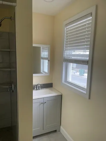 a room with a stove and a window