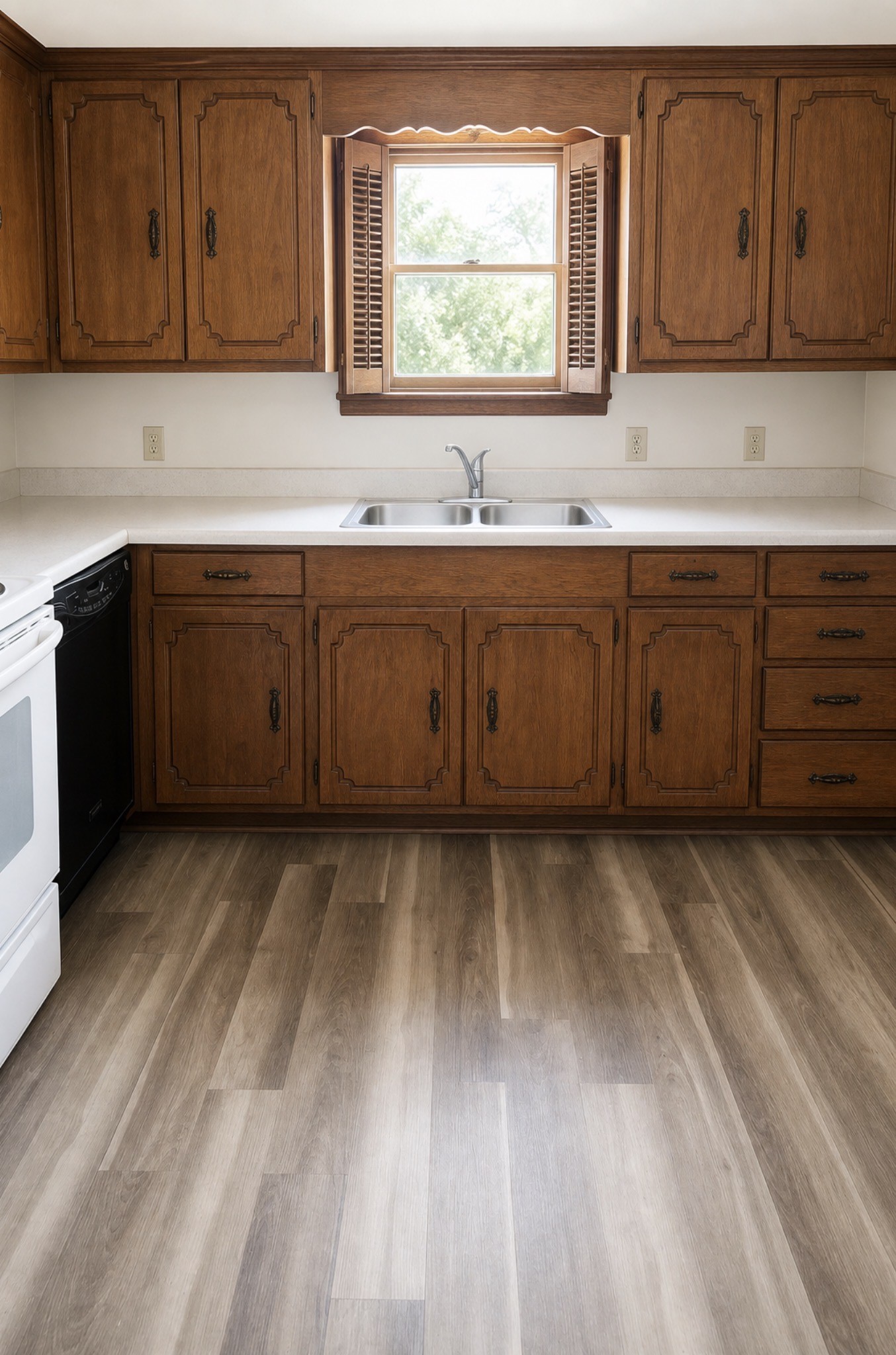 516 Walnut Street McLean, TX 79057 - Photo 4 of 12 a kitchen with a sink window and cabinets