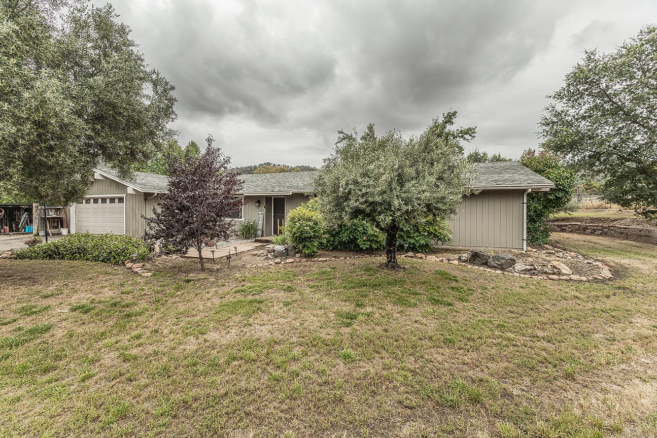 29545 Oak Meadow Road Tollhouse, CA 93667 - Photo 48 of 69 a view of a house with a yard and garage