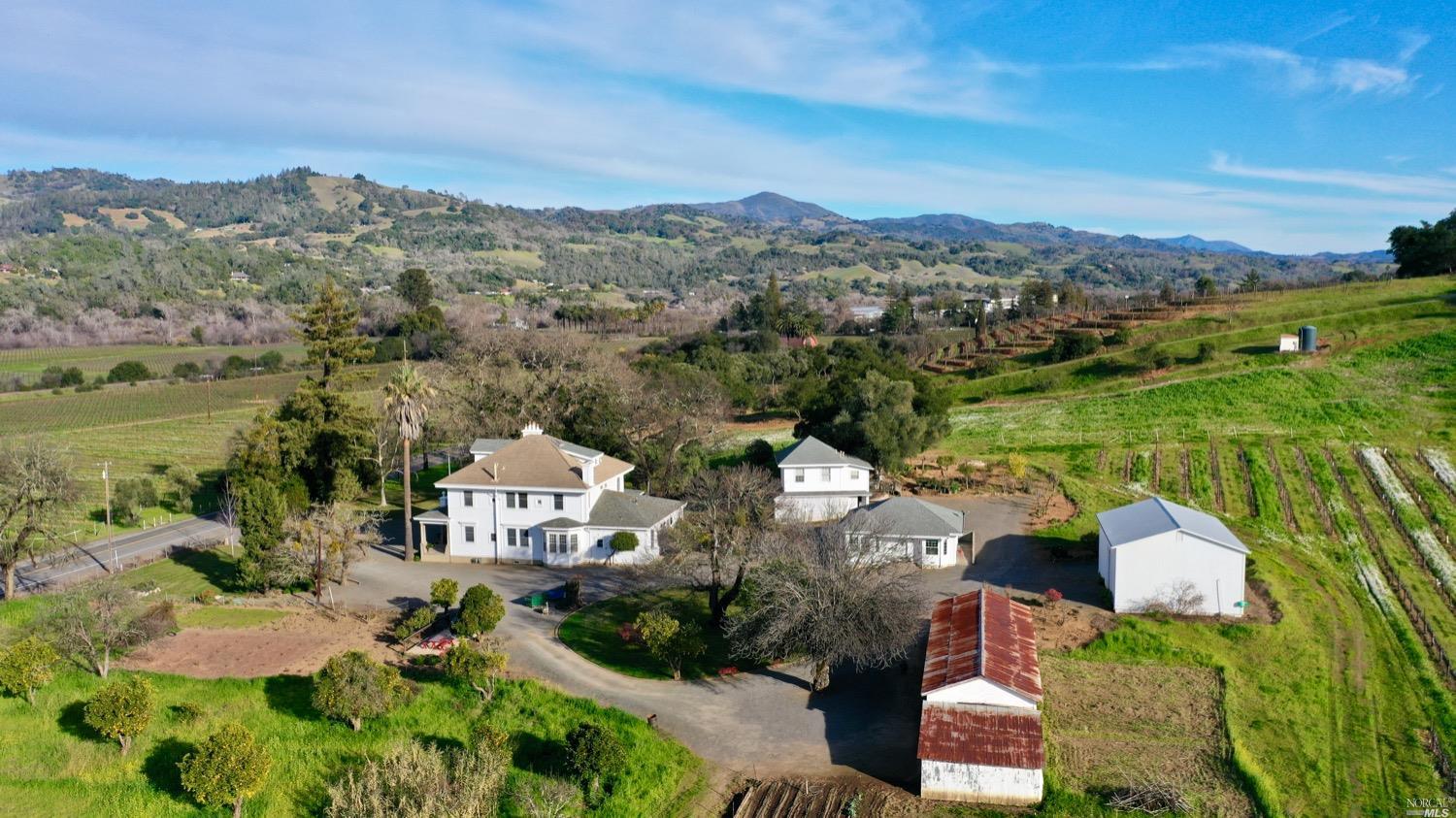 26495 Asti Road Cloverdale, CA 95425 - Photo 1 of 1 an aerial view of residential houses with outdoor space and river