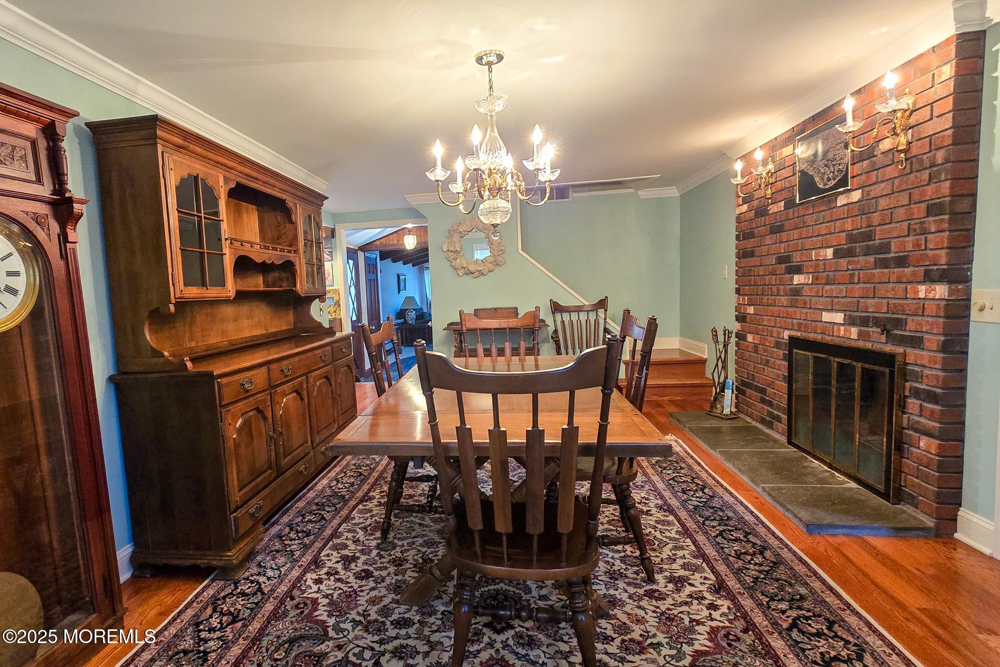 72 Pershing Boulevard Lavallette, NJ 08735 - Photo 21 of 48 a view of a dining room with furniture a chandelier and wooden floor