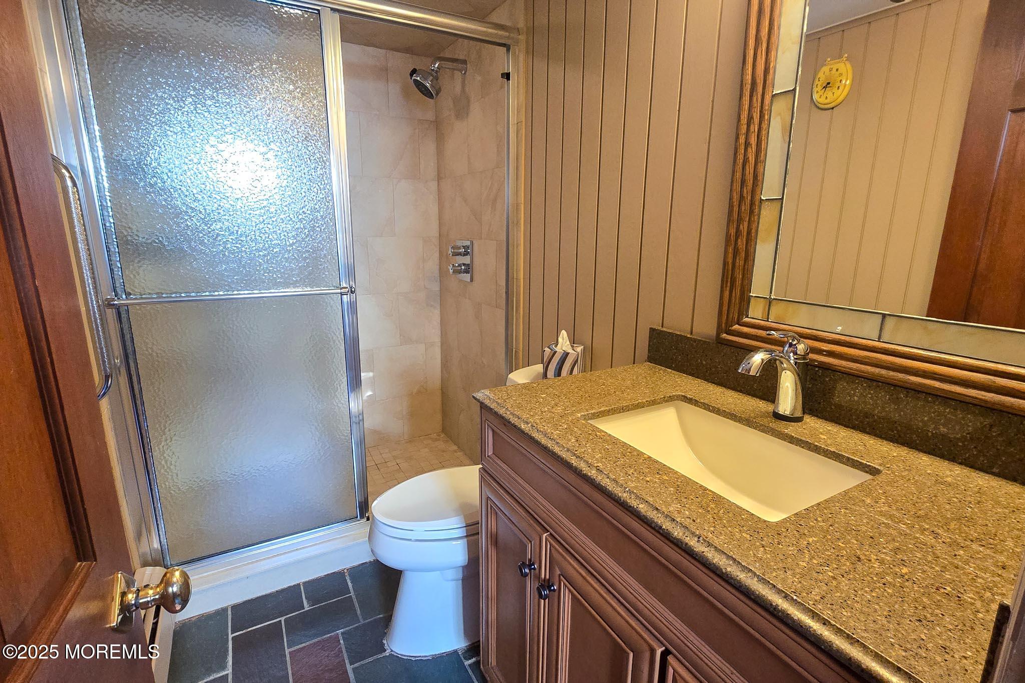 72 Pershing Boulevard Lavallette, NJ 08735 - Photo 27 of 48 a bathroom with a granite countertop sink toilet and shower