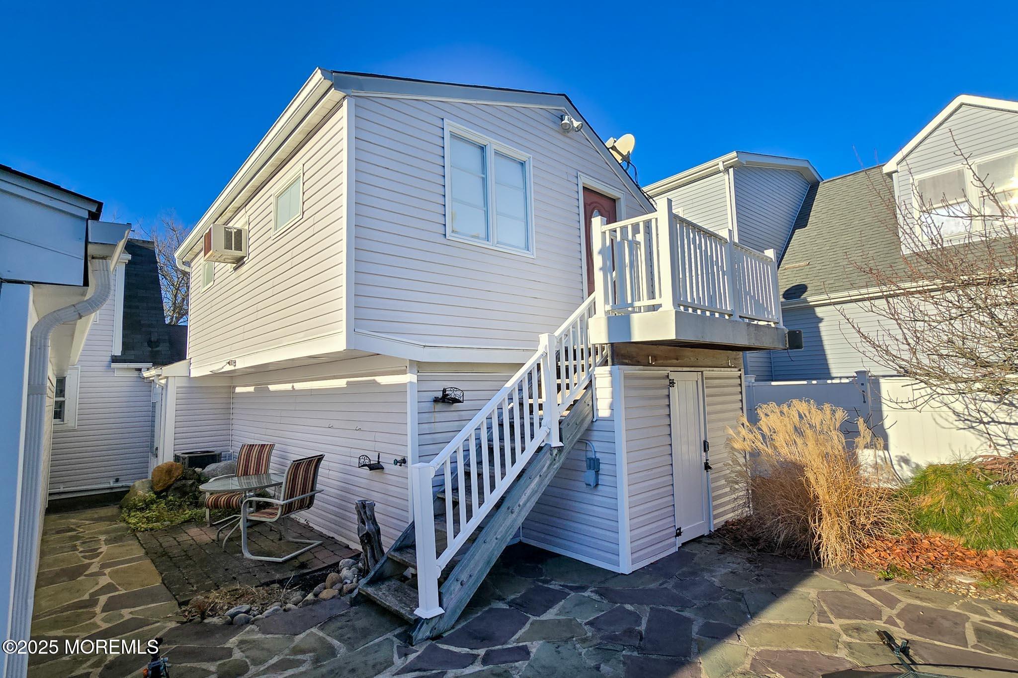72 Pershing Boulevard Lavallette, NJ 08735 - Photo 33 of 48 a view of a house with backyard and sitting area