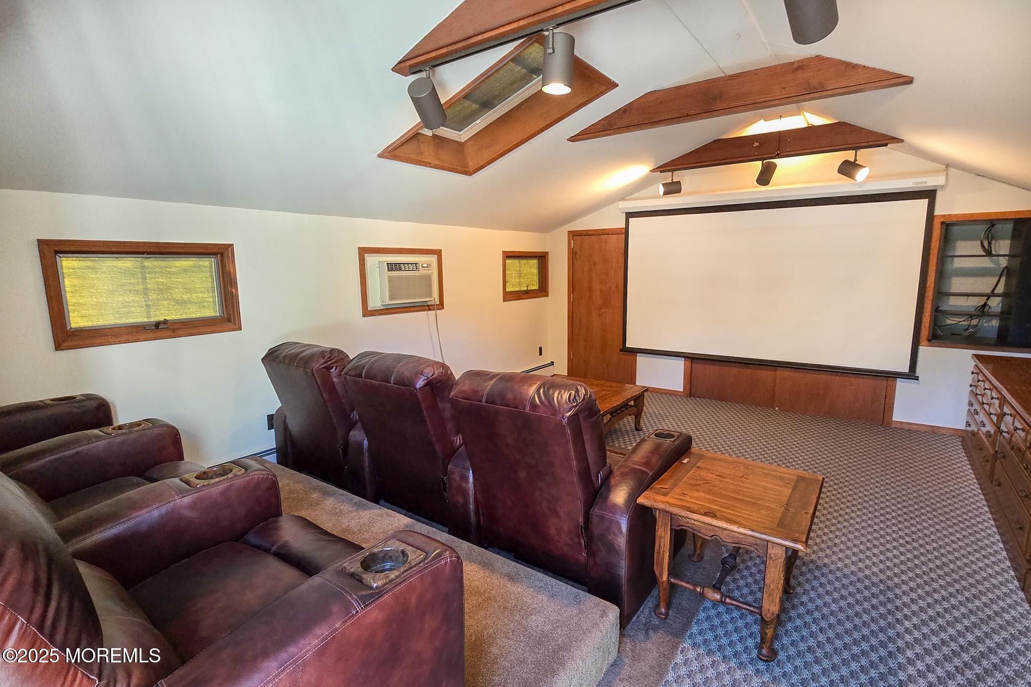 72 Pershing Boulevard Lavallette, NJ 08735 - Photo 34 of 48 a living room with furniture and a flat screen tv