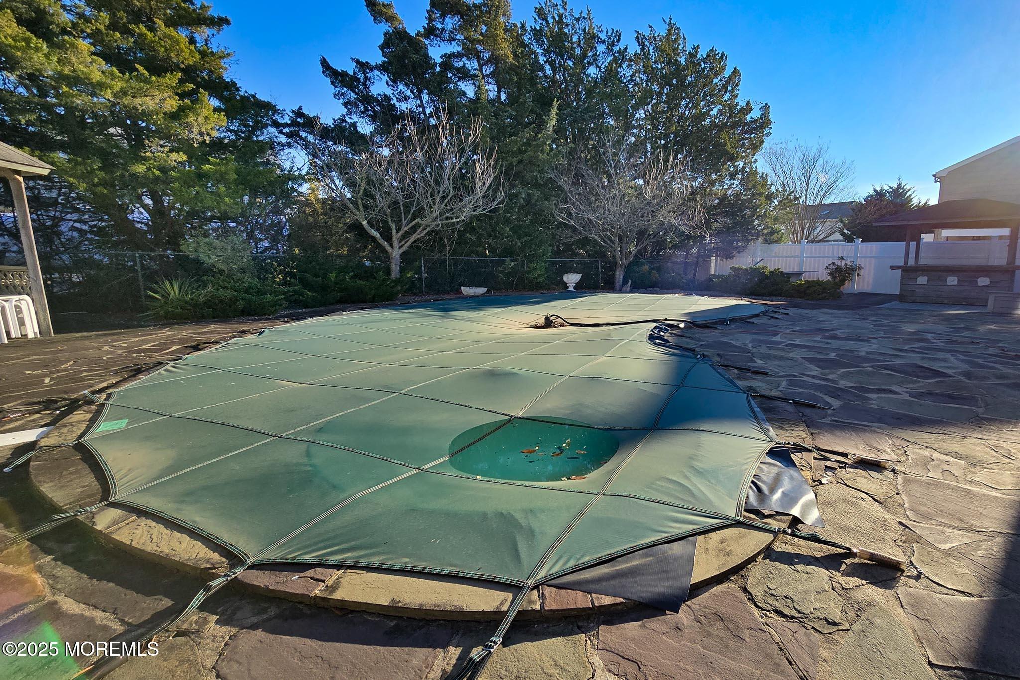 72 Pershing Boulevard Lavallette, NJ 08735 - Photo 37 of 48 a view of a tennis ground with large trees