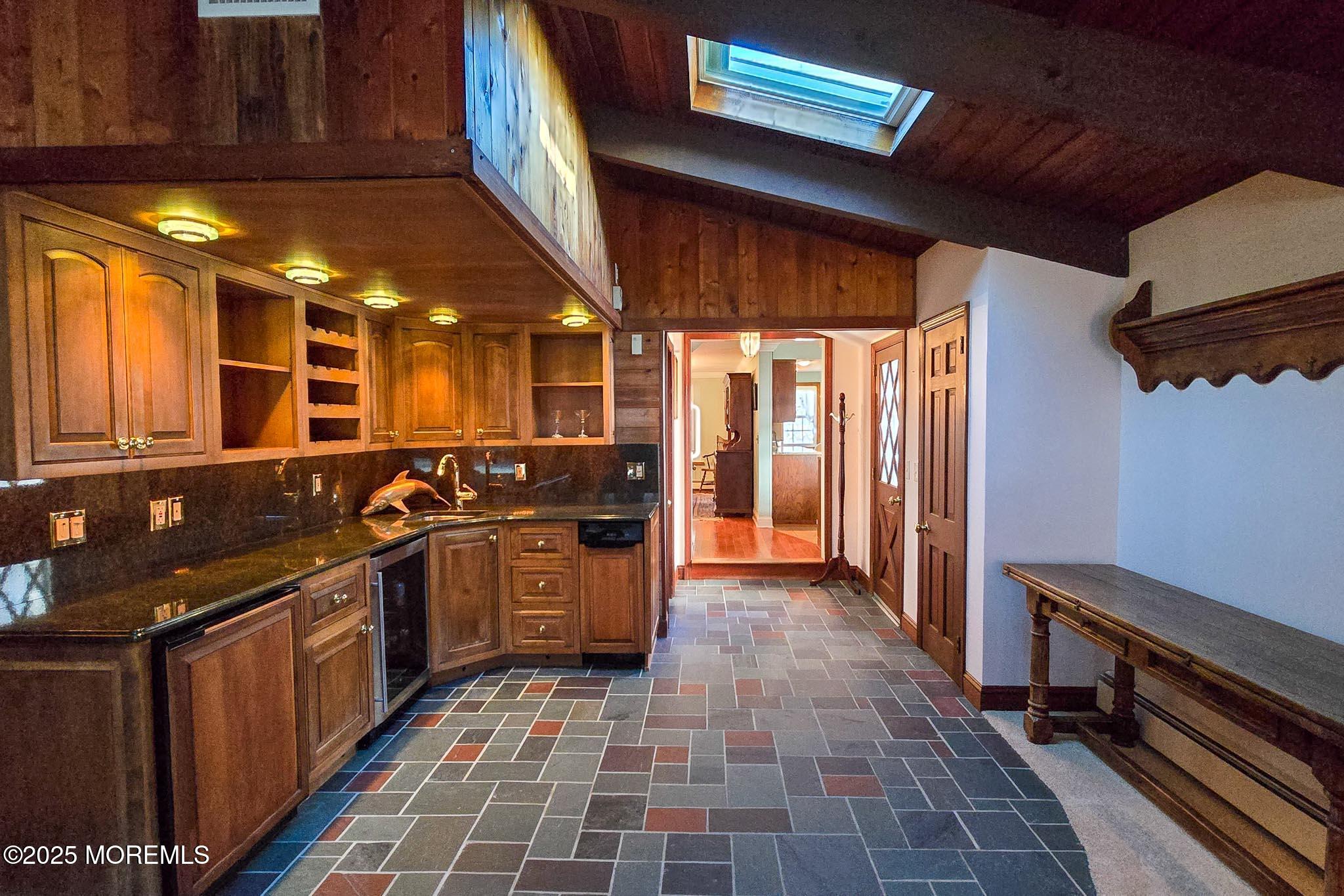 72 Pershing Boulevard Lavallette, NJ 08735 - Photo 10 of 48 a kitchen with stainless steel appliances granite countertop a stove a sink and a refrigerator