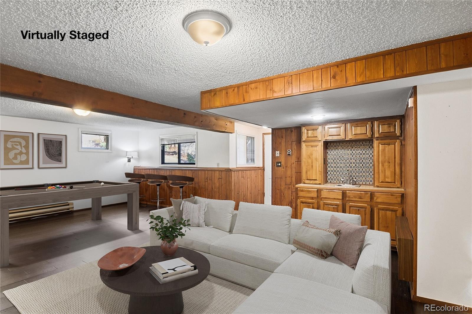 6136 High Drive Morrison, CO 80465 - Photo 17 of 40 a living room with furniture and a table