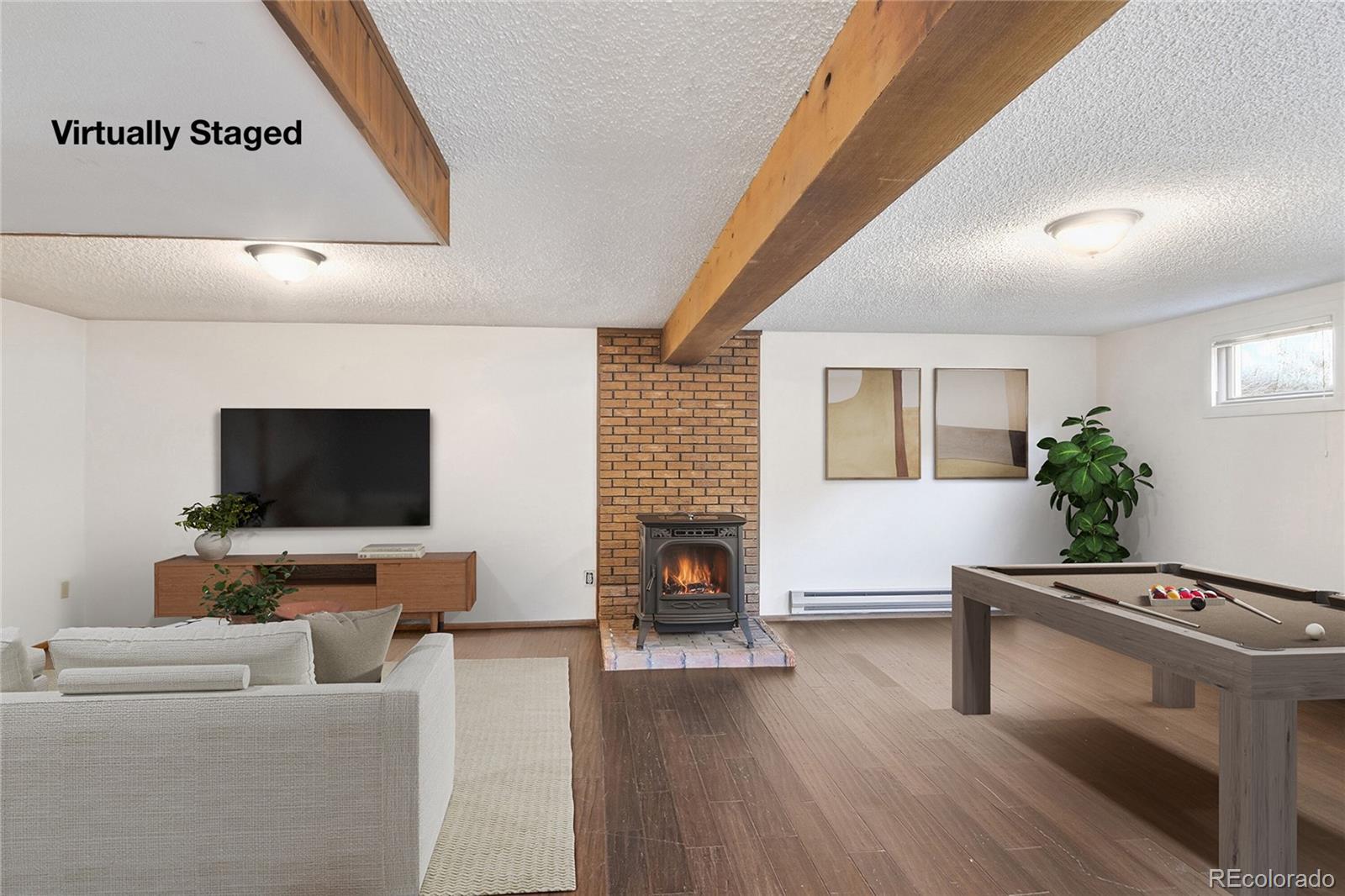 6136 High Drive Morrison, CO 80465 - Photo 18 of 40 a living room with furniture and a flat screen tv