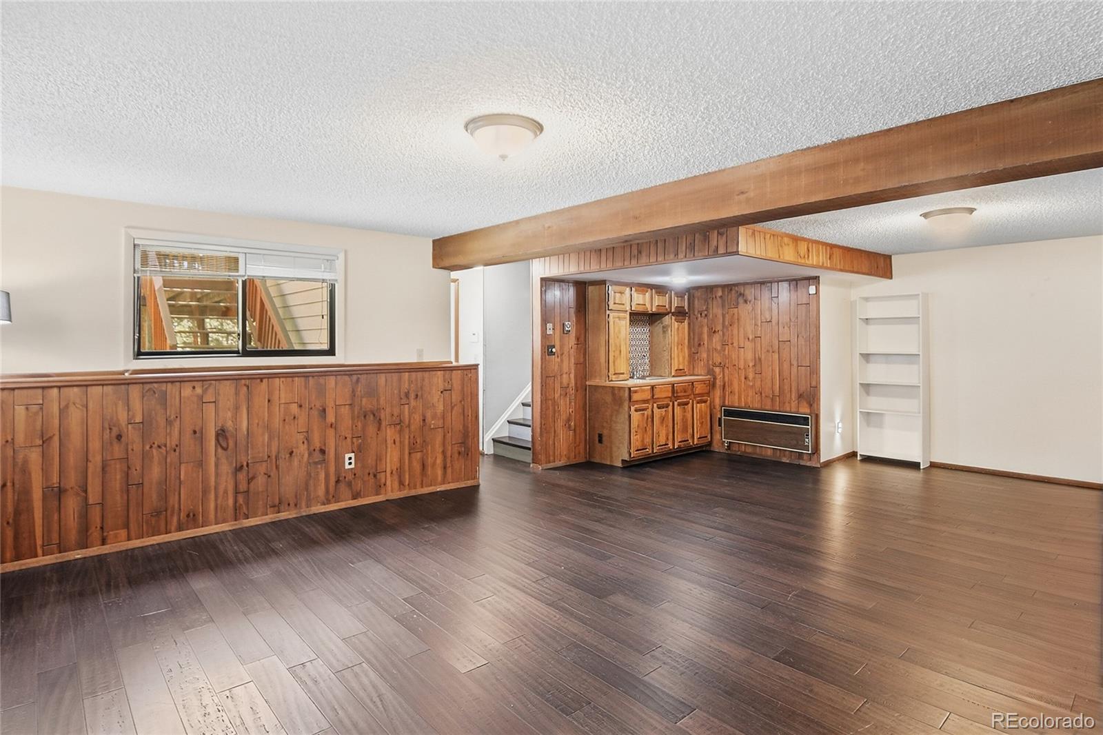 6136 High Drive Morrison, CO 80465 - Photo 20 of 40 a view of an empty room with a window and wooden floor