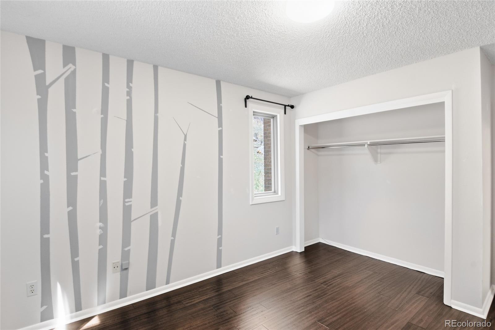 6136 High Drive Morrison, CO 80465 - Photo 24 of 40 a view of an empty room with wooden floor