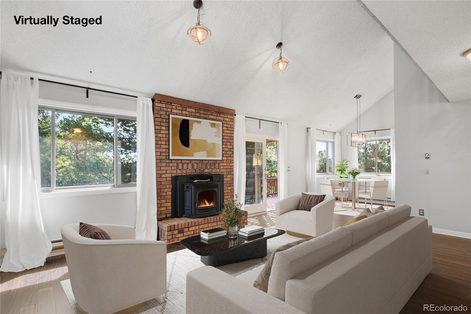 6136 High Drive Morrison, CO 80465 - Photo 3 of 40 a living room with furniture and a fireplace
