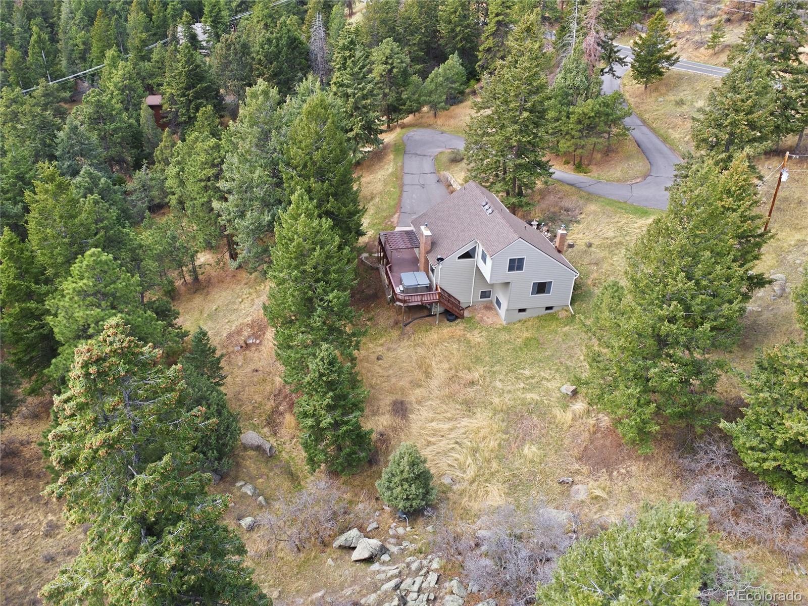 6136 High Drive Morrison, CO 80465 - Photo 34 of 40 a aerial view of a house with a yard and a large tree