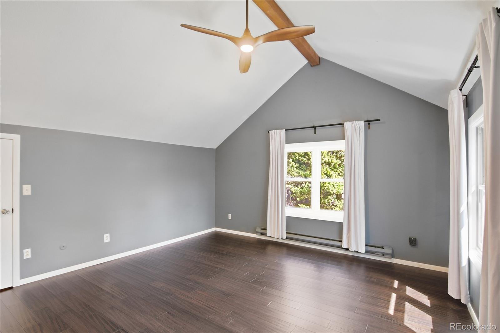 6136 High Drive Morrison, CO 80465 - Photo 9 of 40 a view of an empty room with wooden floor and a window