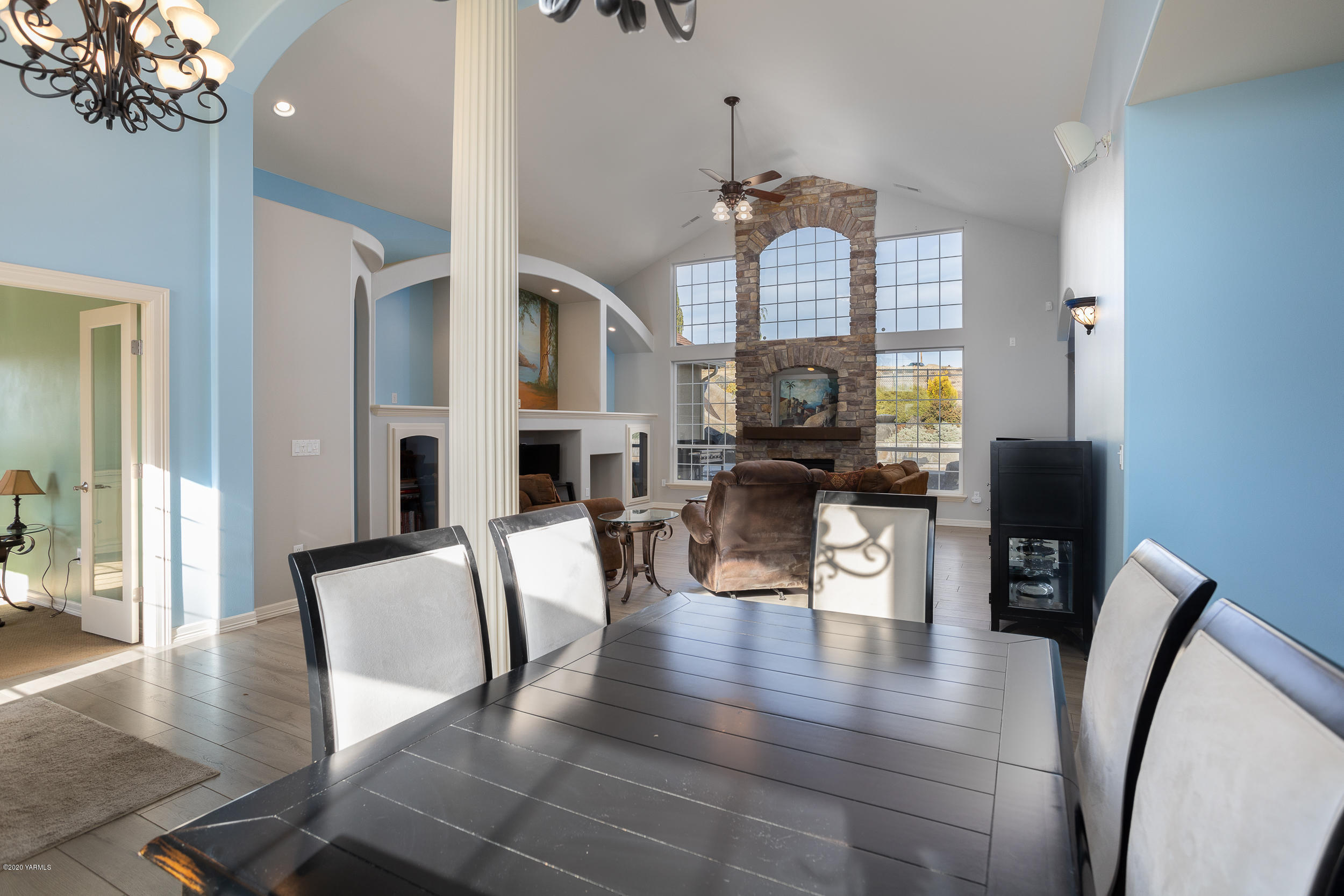 10903 Zier Road Yakima, WA 98908 - Photo 9 of 31 a view of a dining room with furniture a chandelier and wooden floor