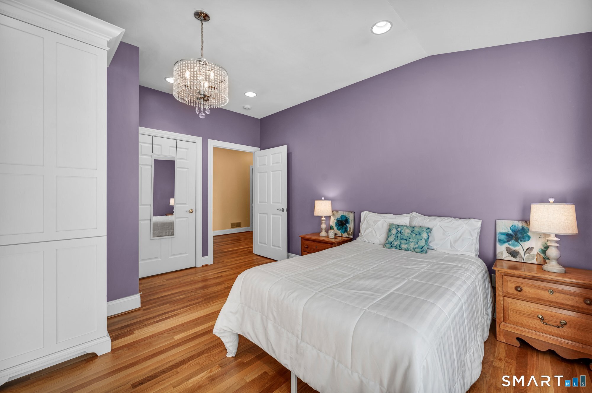 270 Copper Ridge Southington, CT 06489 - Photo 27 of 40 Bedroom 3 features refinished hardwood floors, vaulted ceilings, a custom built-in closet cabinet, private access to the side deck and ramp, and a dedicated door providing direct access to the hall bathroom.