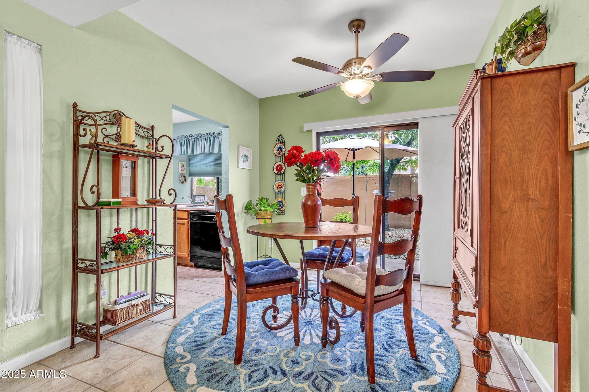 5640 East Bell Road, Unit 1055 Scottsdale, AZ 85254 - Photo 9 of 39 a view of a dining room with furniture window and wooden floor