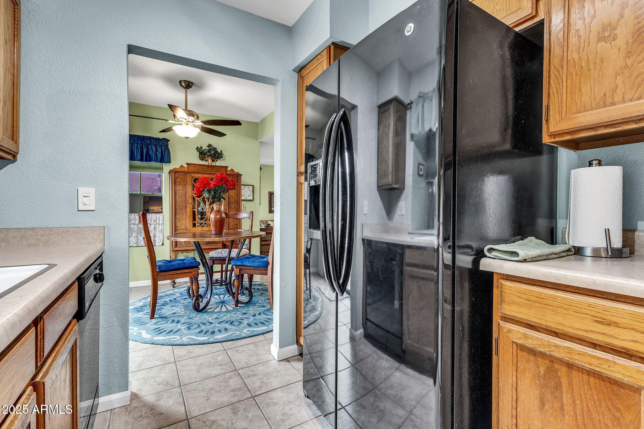 5640 East Bell Road, Unit 1055 Scottsdale, AZ 85254 - Photo 15 of 39 a view of a kitchen area with furniture and a window