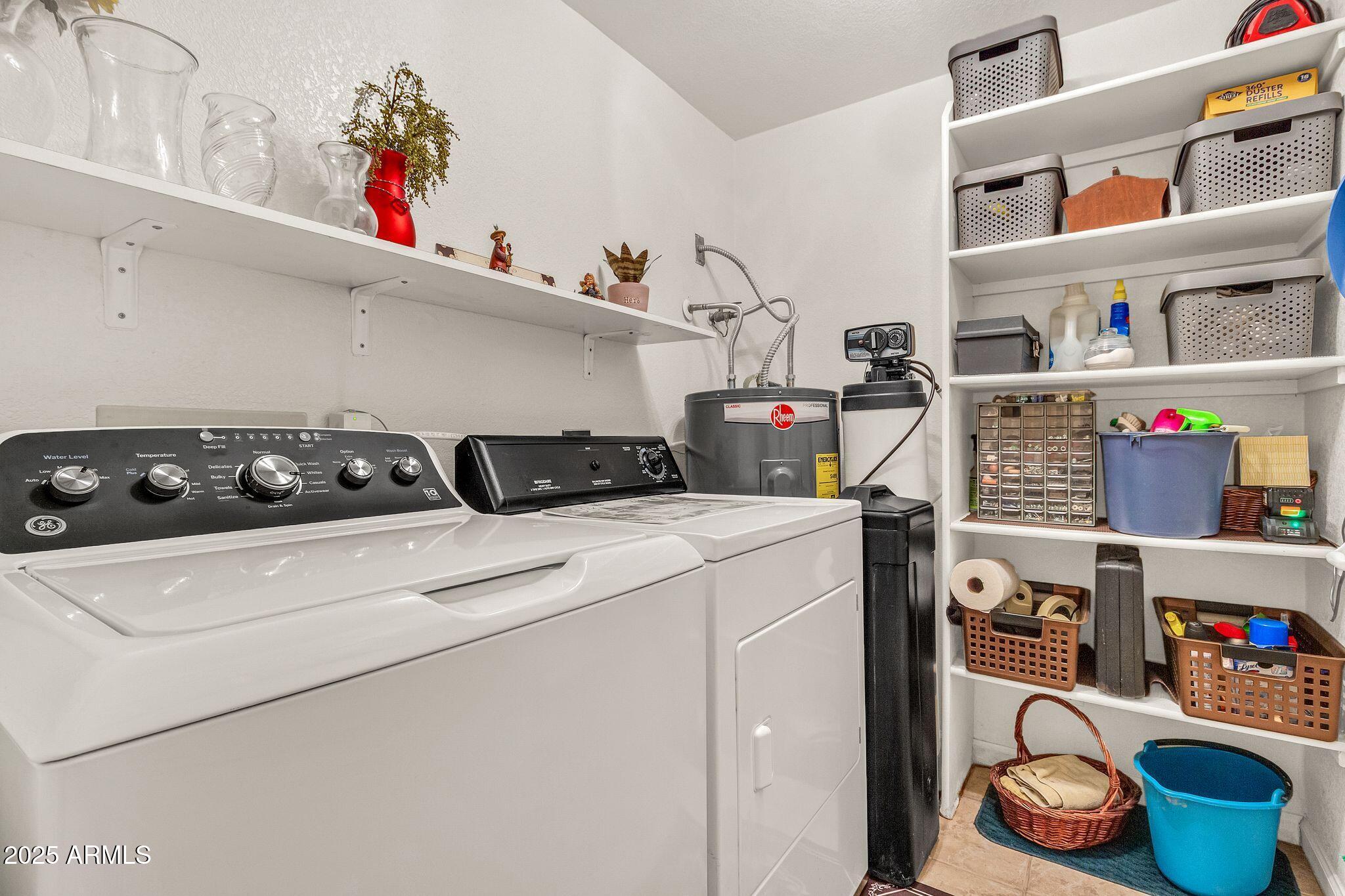 5640 East Bell Road, Unit 1055 Scottsdale, AZ 85254 - Photo 18 of 39 a utility room with lots of clutter and cabinets