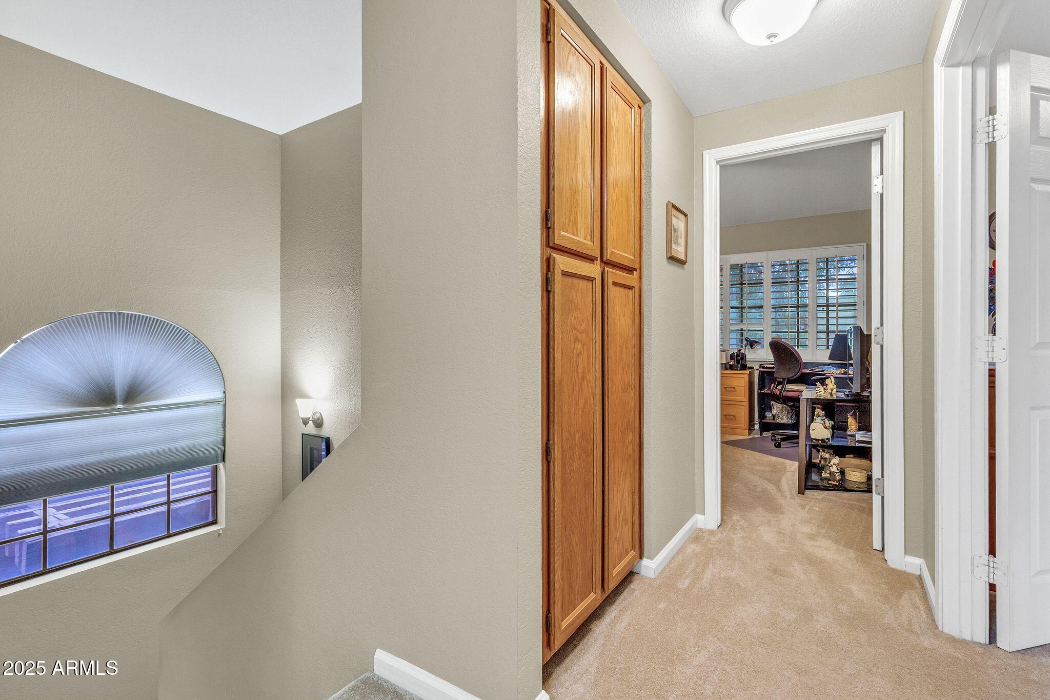 5640 East Bell Road, Unit 1055 Scottsdale, AZ 85254 - Photo 25 of 39 a view of hallway with livingroom and furniture