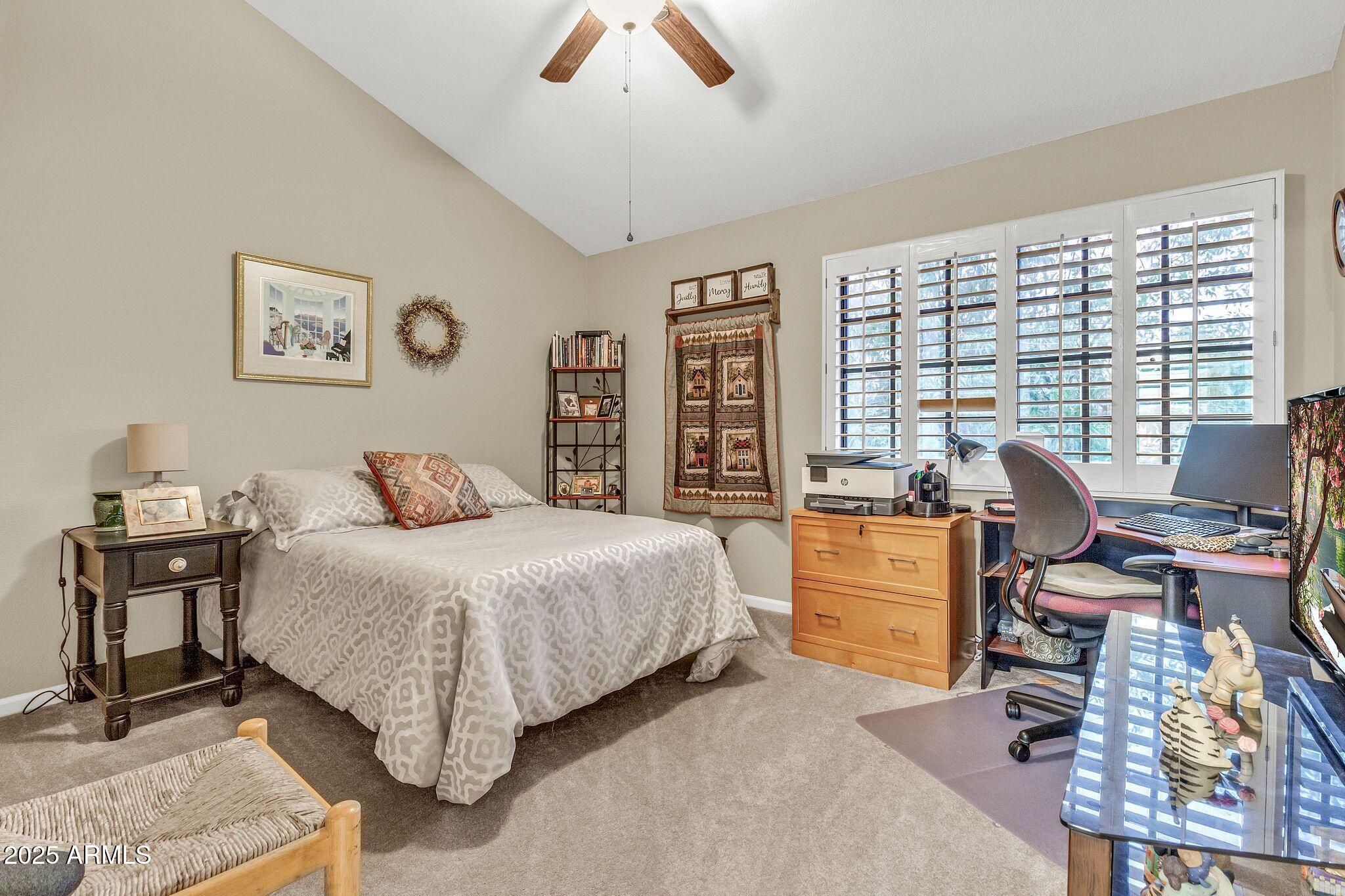 5640 East Bell Road, Unit 1055 Scottsdale, AZ 85254 - Photo 27 of 39 a bedroom with a bed and a desk