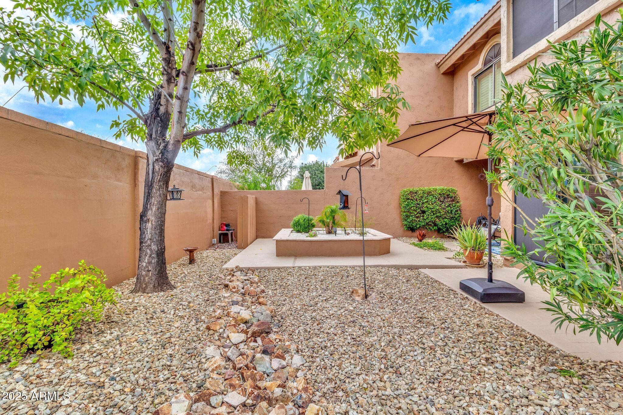 5640 East Bell Road, Unit 1055 Scottsdale, AZ 85254 - Photo 29 of 39 a view of a back yard of the house