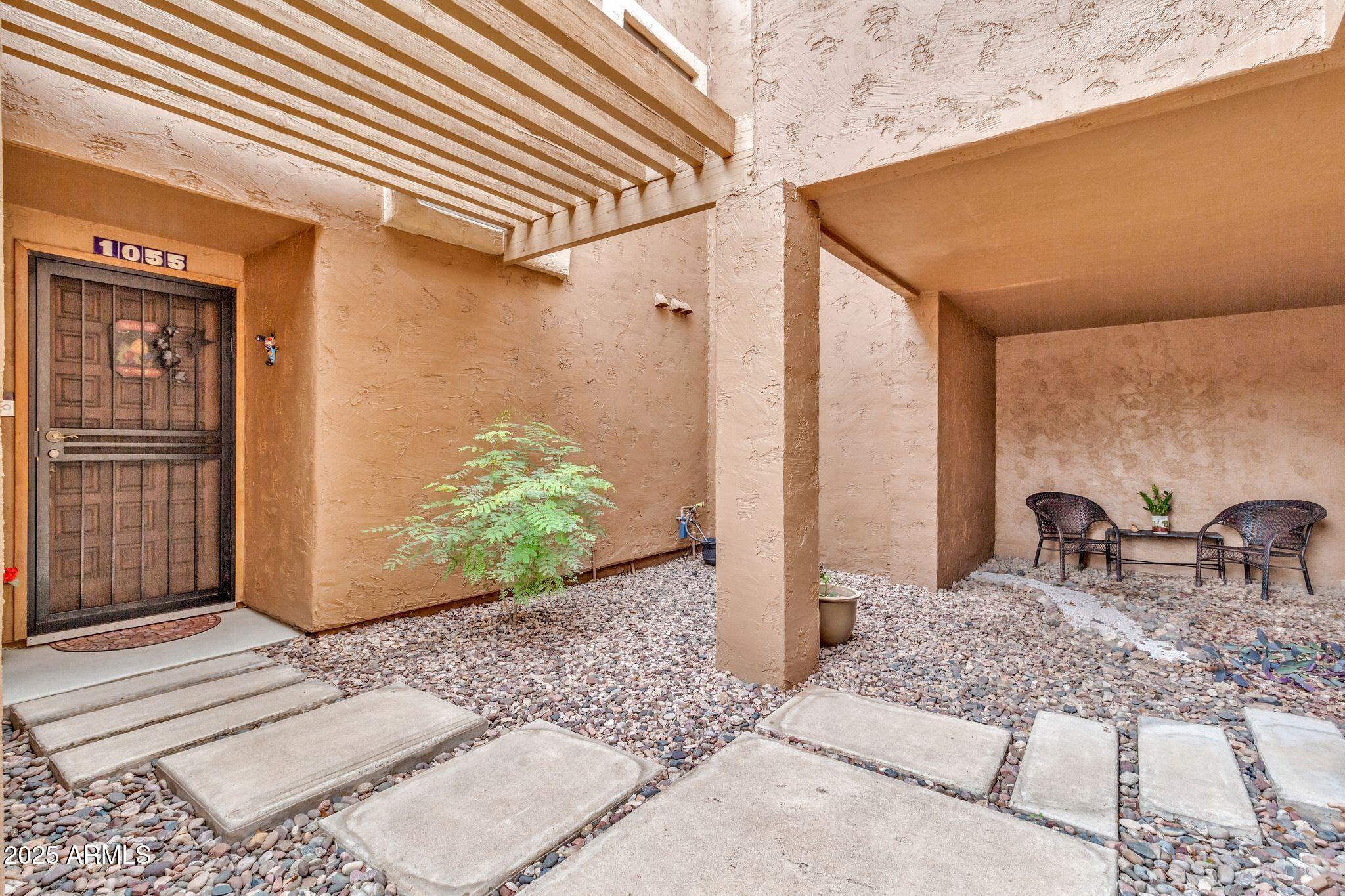 5640 East Bell Road, Unit 1055 Scottsdale, AZ 85254 - Photo 6 of 39 a view of balcony with couch