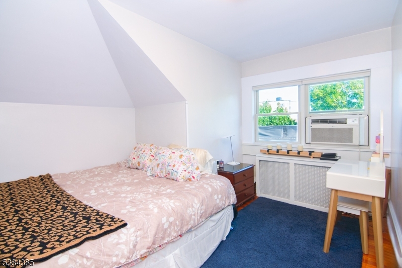 306 Springfield Avenue, Unit 3 Summit, NJ 07901 - Photo 12 of 20 a bedroom with a bed and a window