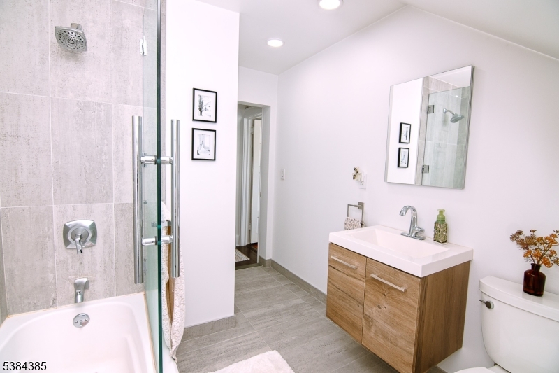 306 Springfield Avenue, Unit 3 Summit, NJ 07901 - Photo 14 of 20 a bathroom with a sink and a bath tub