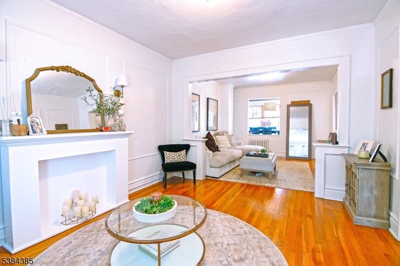 306 Springfield Avenue, Unit 3 Summit, NJ 07901 - Photo 3 of 20 a living room with furniture and a fireplace