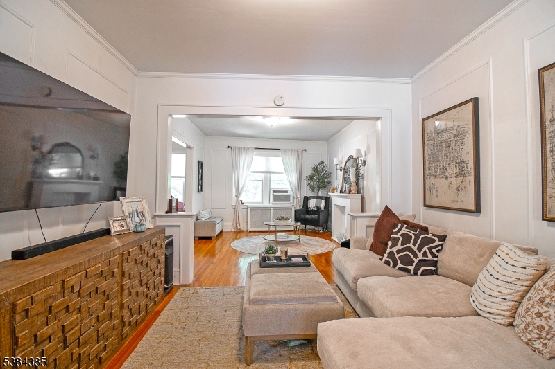 306 Springfield Avenue, Unit 3 Summit, NJ 07901 - Photo 5 of 20 a living room with furniture and a flat screen tv