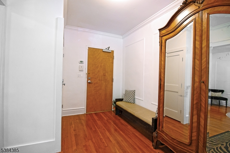 306 Springfield Avenue, Unit 3 Summit, NJ 07901 - Photo 7 of 20 a view of front door with wooden floor