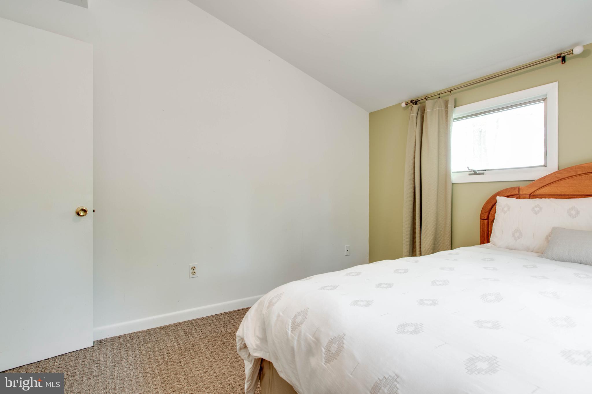 5519 Woodbine Road Sykesville, MD 21784 - Photo 35 of 69 a bedroom with a bed and a window