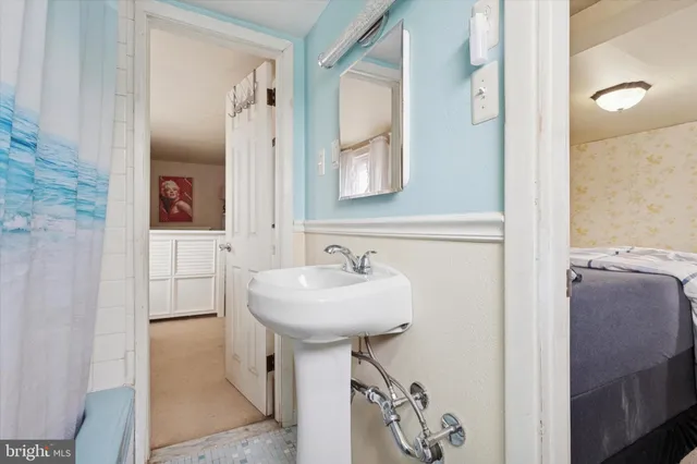 a bathroom with a sink and a mirror