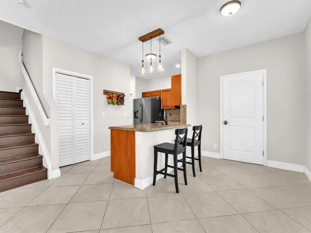 a view of kitchen with furniture and outdoor seating