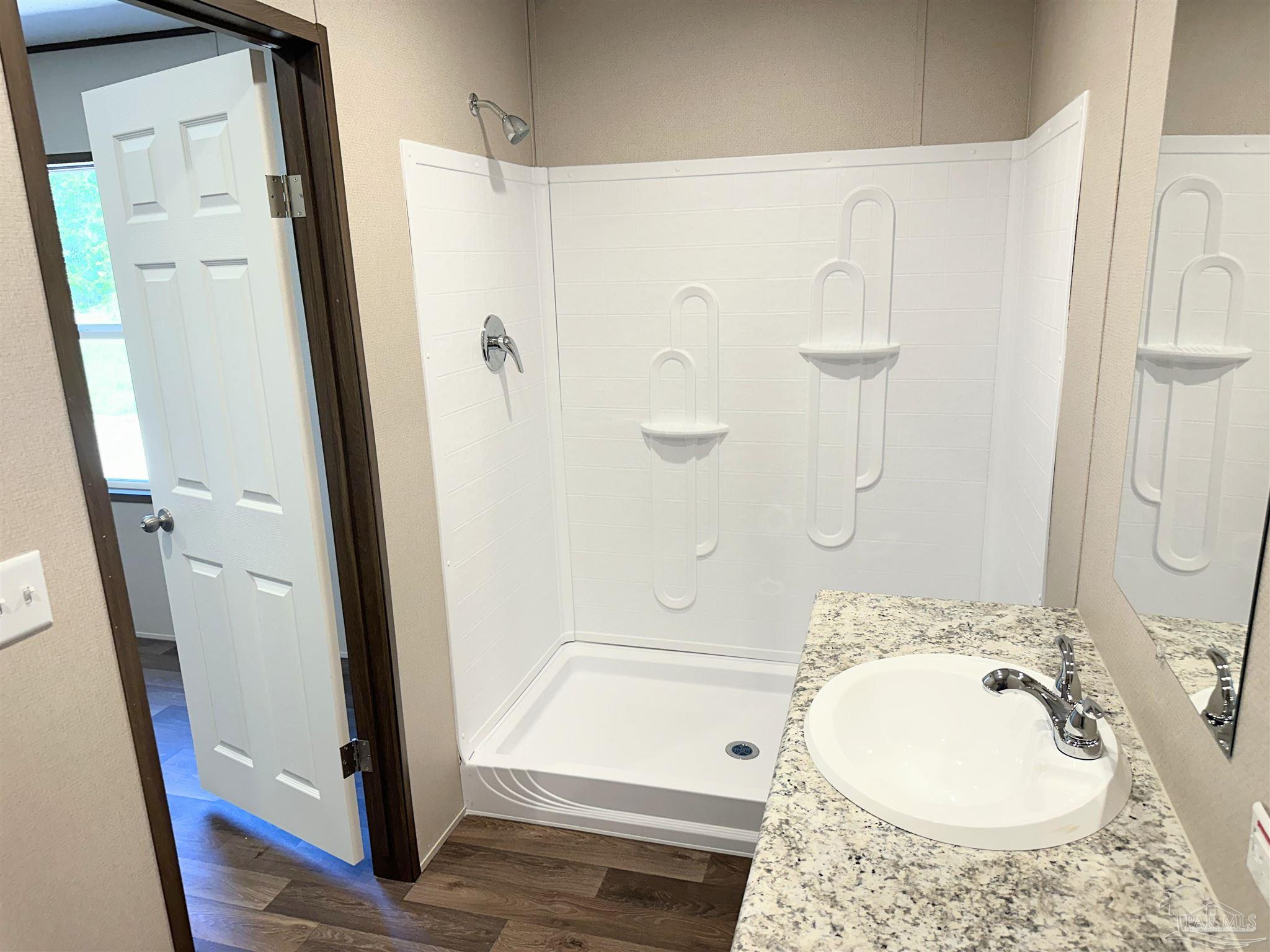 0 T Bridge Road Red Level, AL 36474 - Photo 15 of 25 a bathroom with a granite countertop sink toilet and shower