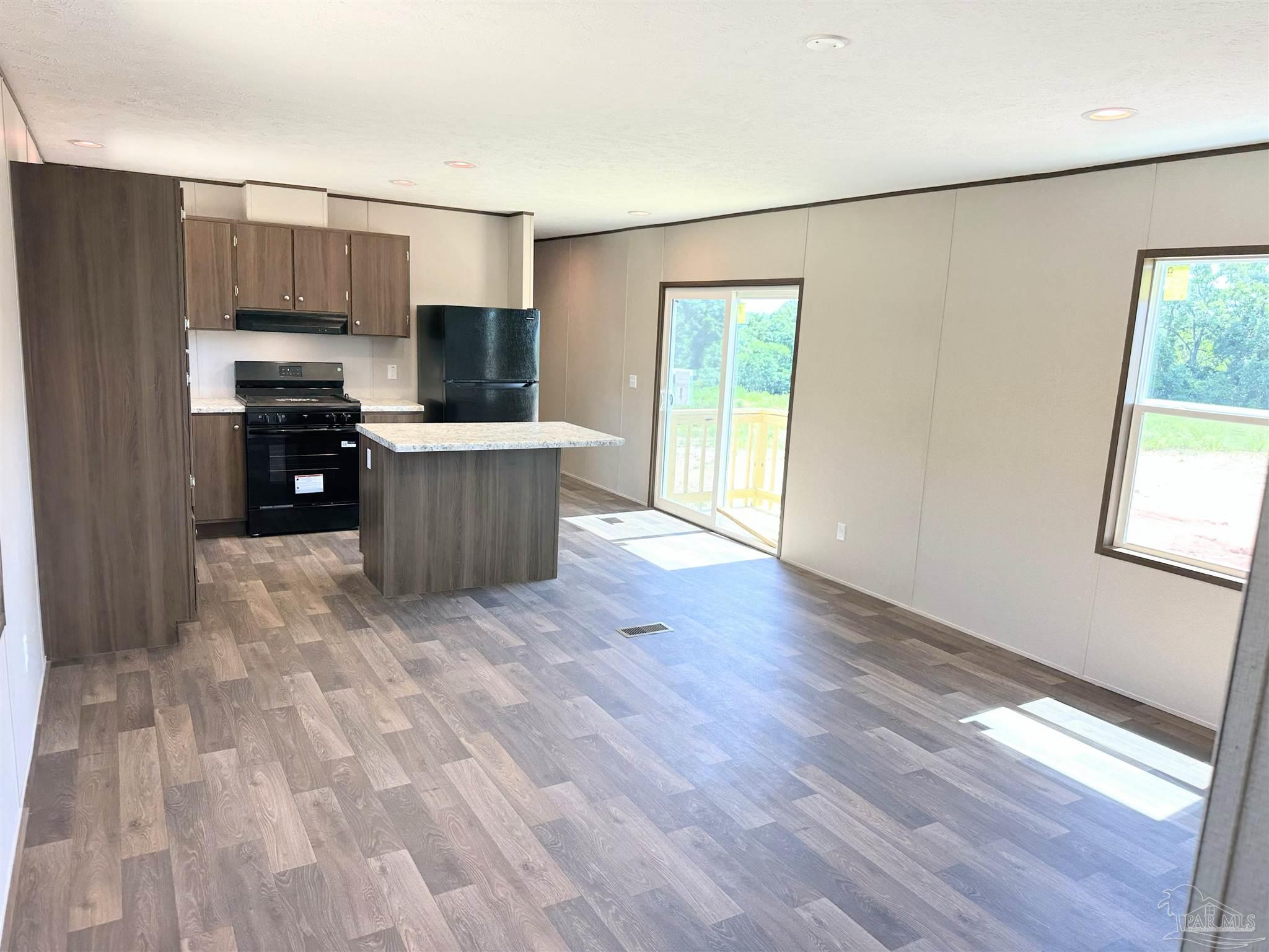0 T Bridge Road Red Level, AL 36474 - Photo 2 of 25 a kitchen with a refrigerator and a stove top oven
