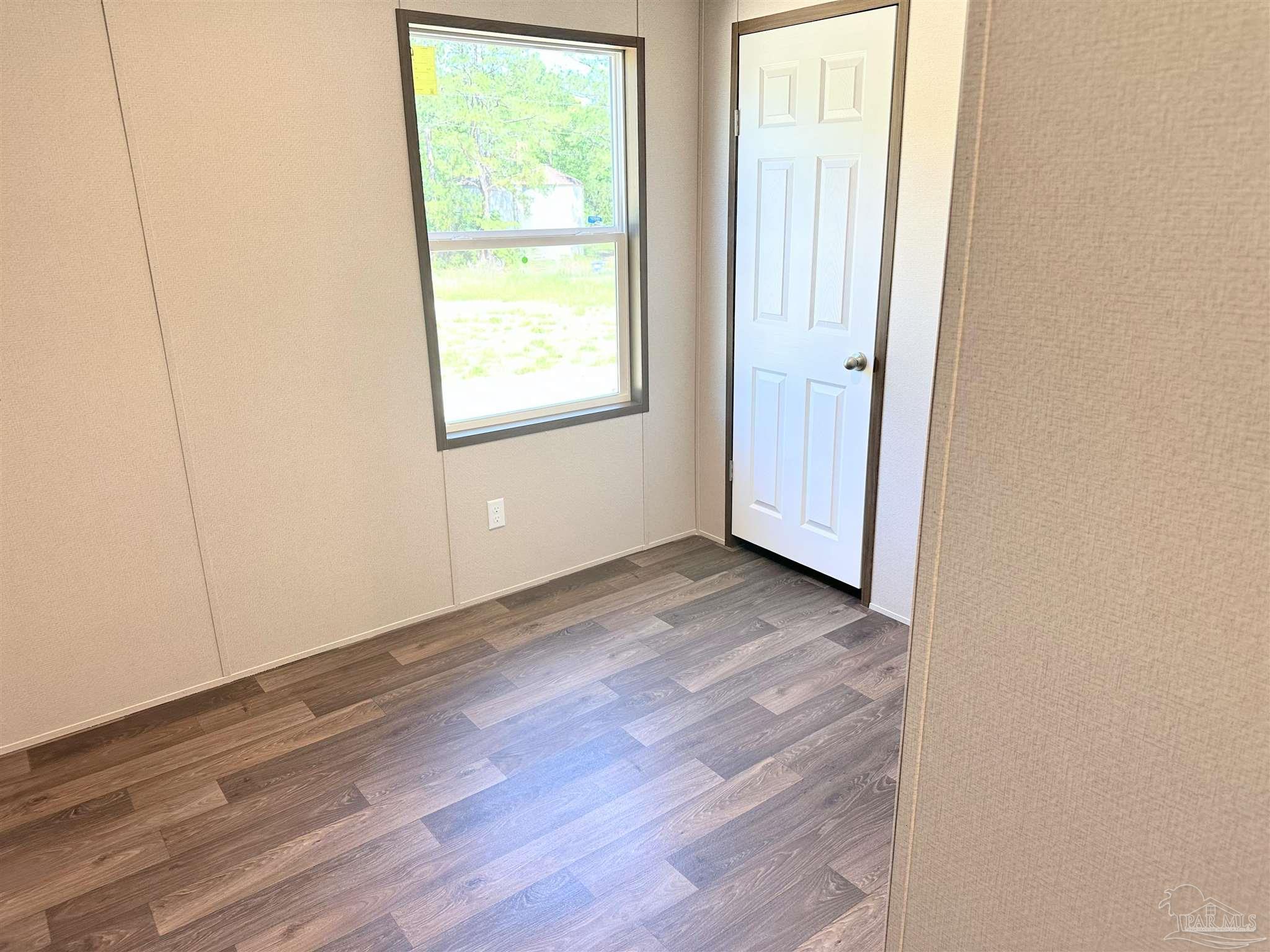 0 T Bridge Road Red Level, AL 36474 - Photo 6 of 25 an empty room with wooden floor and windows