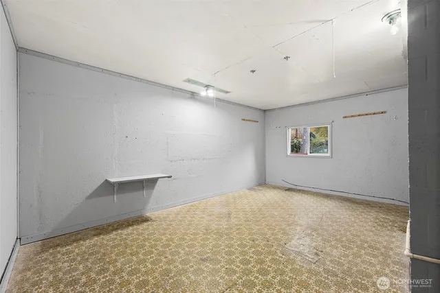 an empty room with a empty space and windows