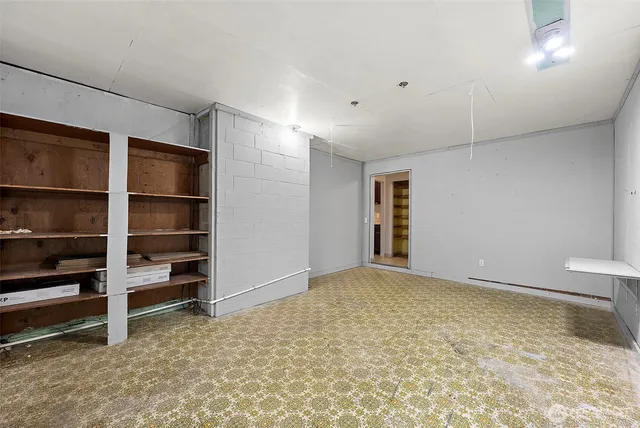 a view of an empty room with a closet