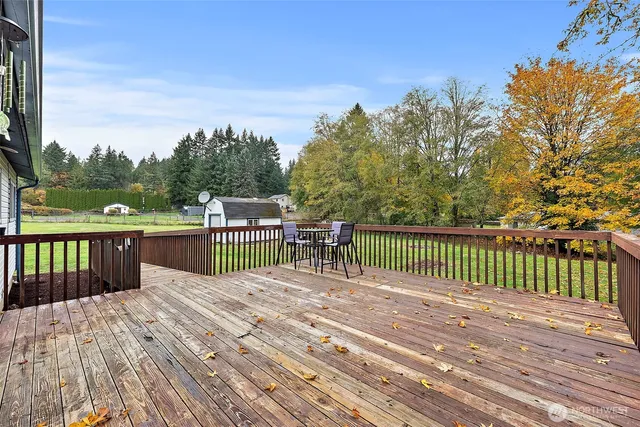 a balcony with view of trees in front of it