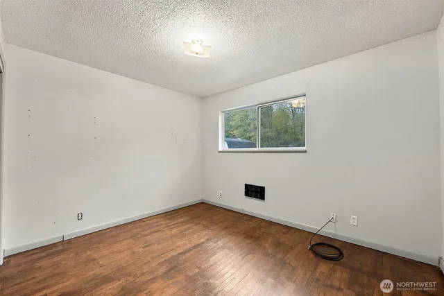 an empty room with a empty space and windows